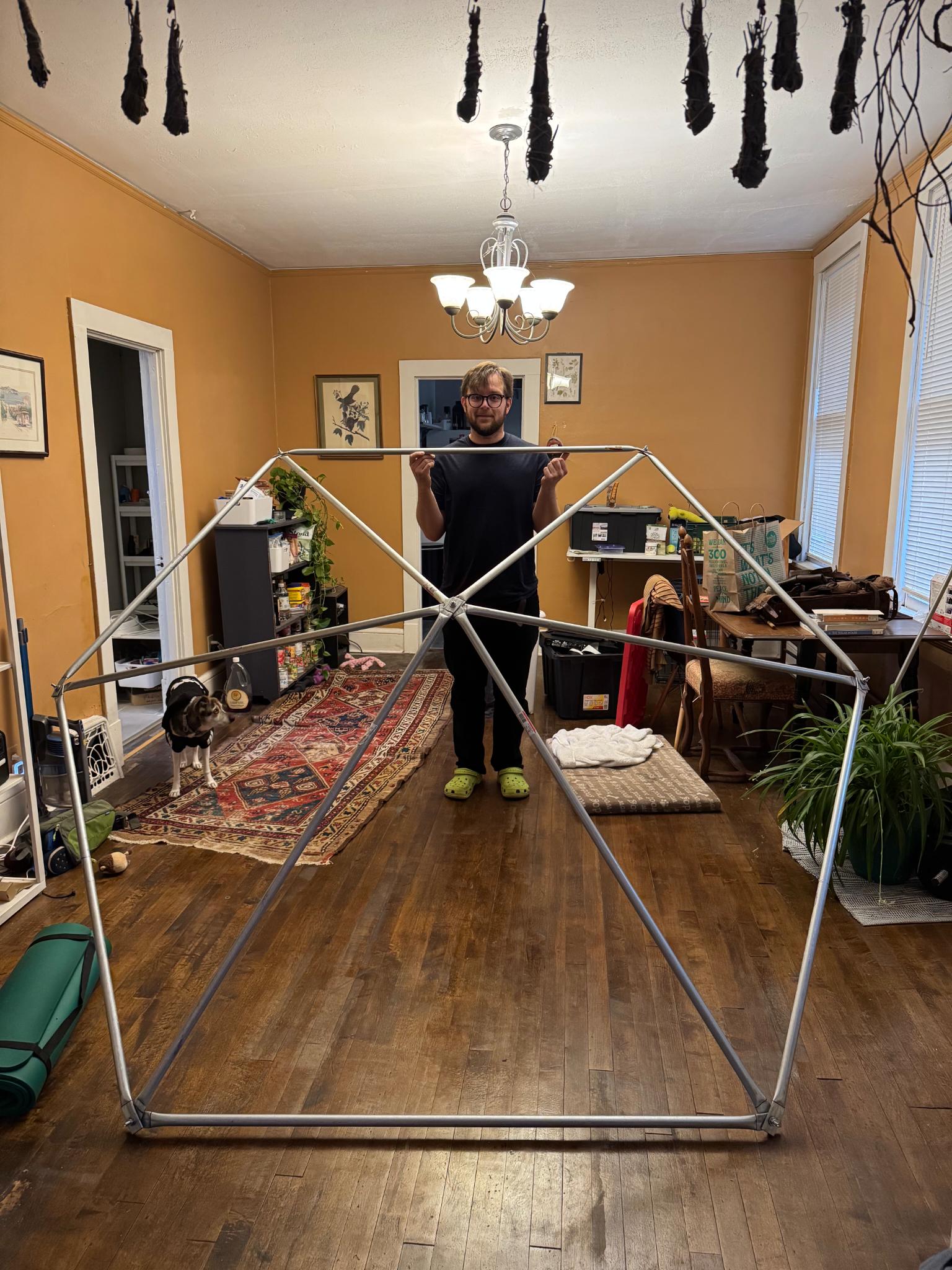 Standing inside the test-assembled dome frame indoors